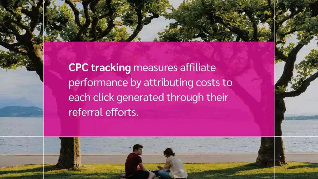 A serene lakeside scene with two people sitting on the grass, surrounded by lush trees under a bright sky.