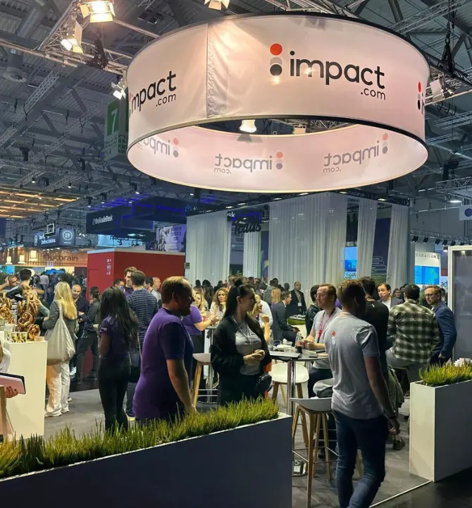 DMEXCO attendees visiting discoverimpact.wpenginepowered.com booth