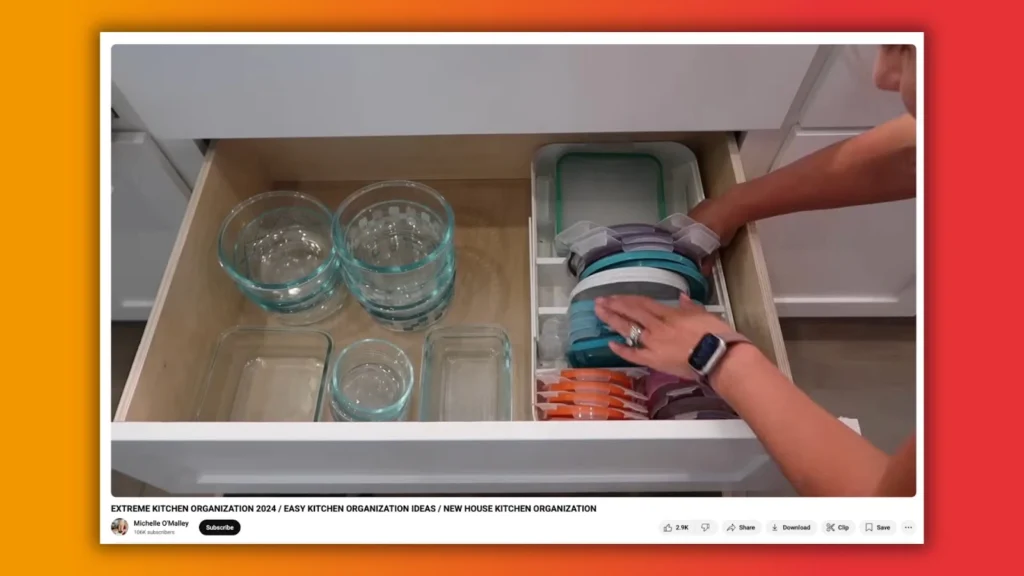 A person organizes various glass and plastic food storage containers in a neat kitchen drawer, showcasing efficient kitchen organization.