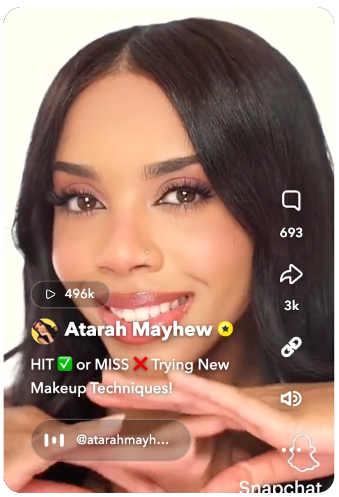 A woman demonstrating makeup techniques with her hands, focusing on beauty tips in a vibrant, engaging video format.