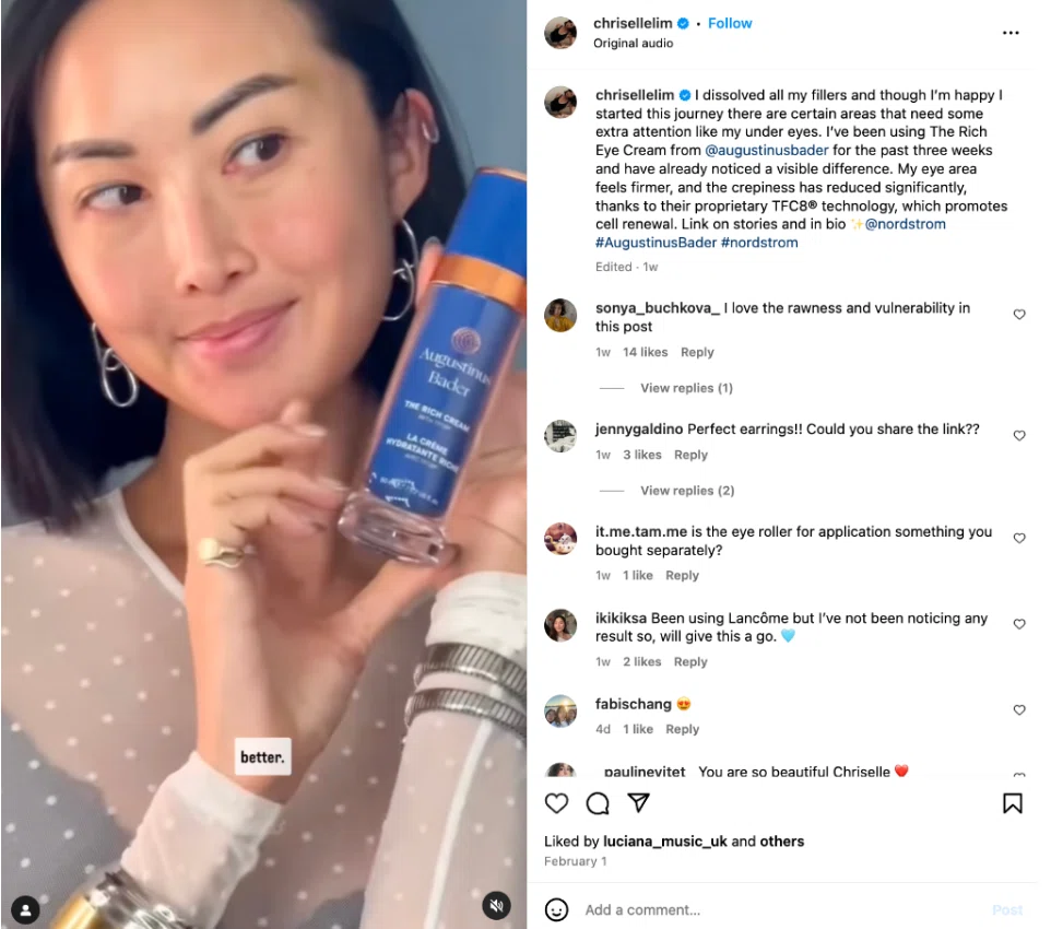 A person holds a blue skincare bottle labeled "Augustinus Bader The Rich Cream," showcasing their skincare journey.