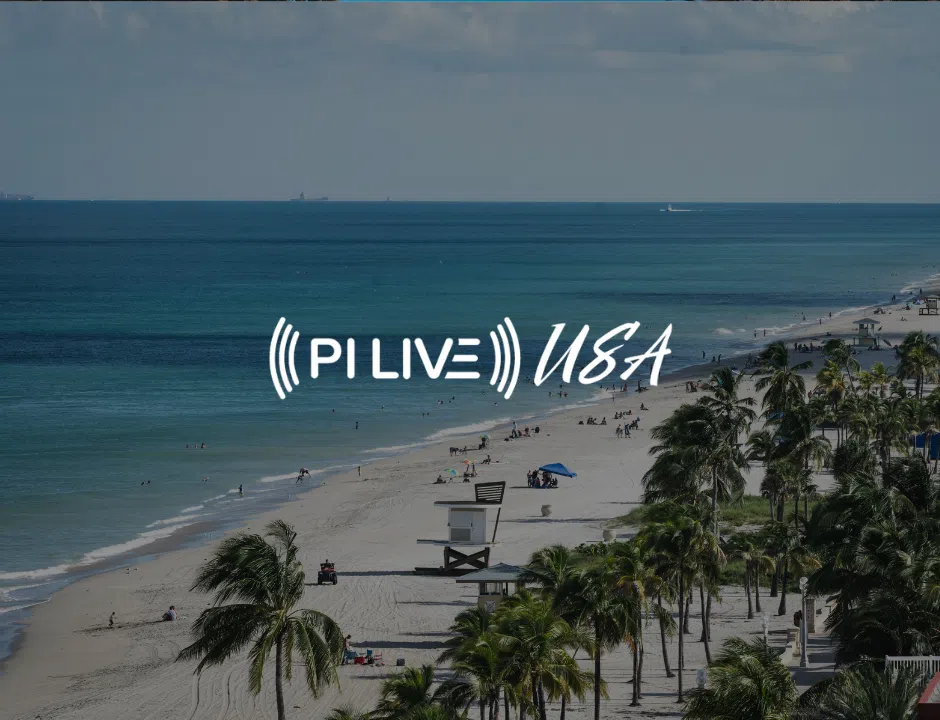 A scenic beach view with people enjoying the sun, palm trees, and waves, featuring the text "PI LIVE USA" prominently overlayed.