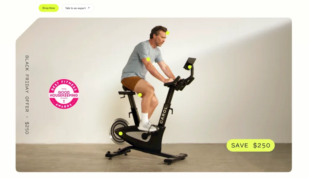 A person exercises on a sleek, black stationary bike in a bright, minimalistic space, showcasing a fitness product.