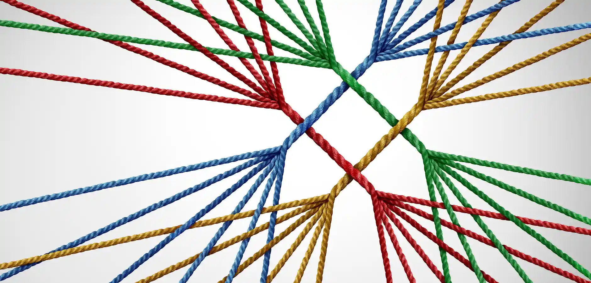 Colorful ropes in red, blue, green, and yellow intricately interweave against a light background, forming a complex geometric pattern.