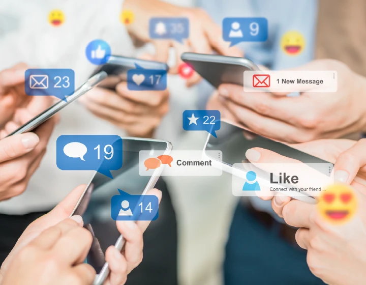 People on their phones, with social icons floating around the phones