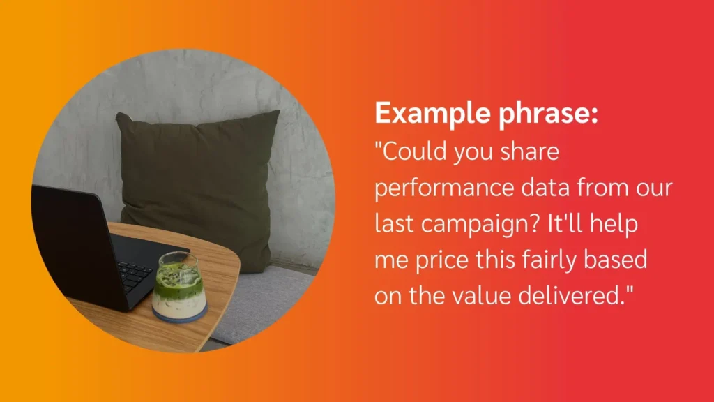 A laptop on a wooden table beside a green drink, with a large cushion in the background and a quote about performance data pricing.
