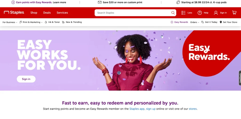 A woman in a burgundy top smiles and gestures, surrounded by colorful confetti, promoting Staples' Easy Rewards program.