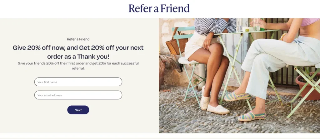 Refer a friend promotion with a form for entering a name and email, showcasing two people seated at a café table.