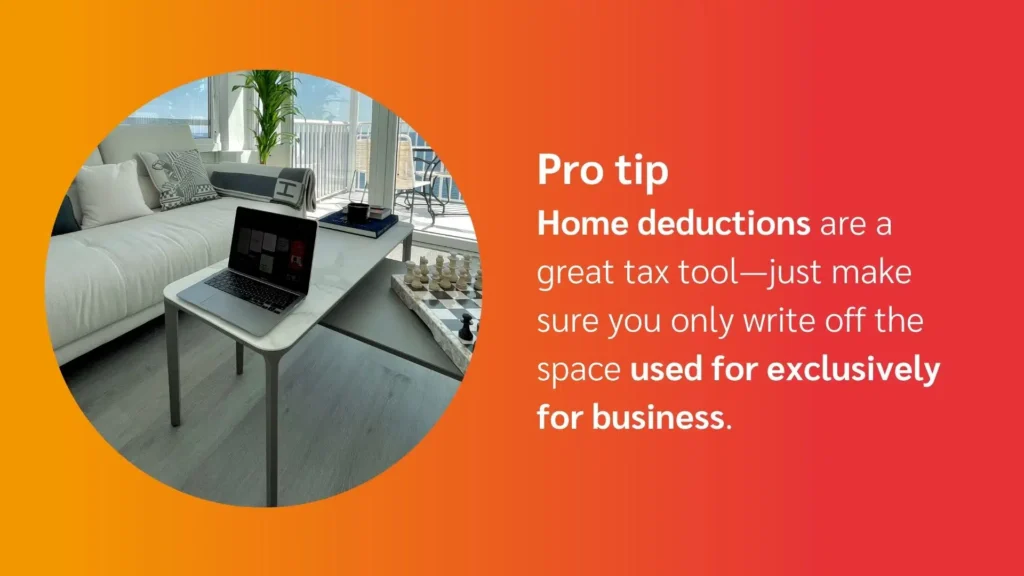 A modern home office setup features a laptop on a small table, with a sofa, plants, and a chess set in the bright, airy room.