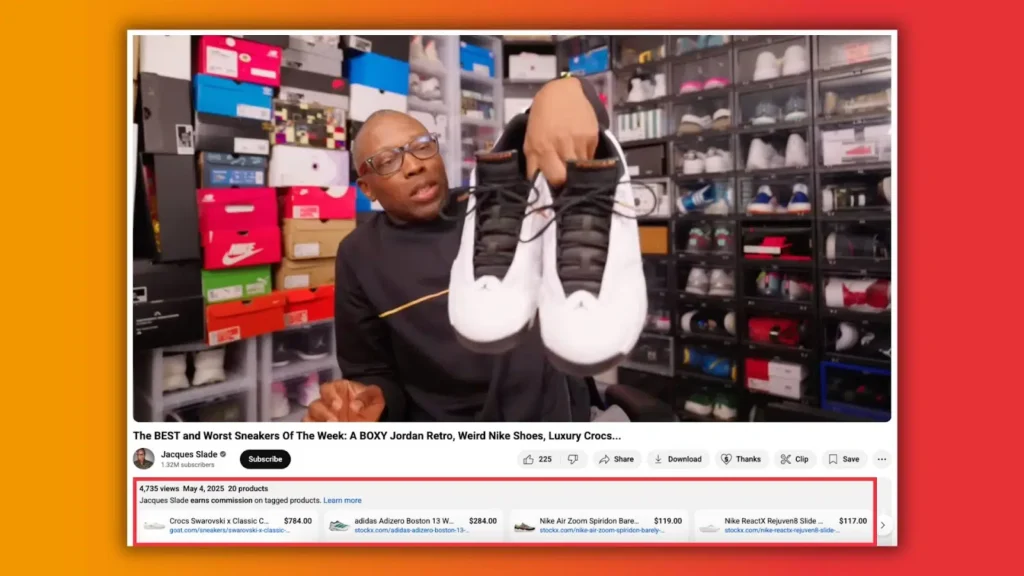 A person holding a pair of black and white sneakers in front of a colorful collection of shoeboxes and displayed shoes.
