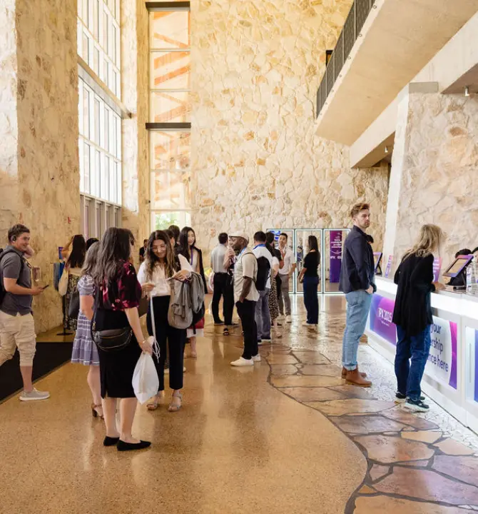 Welcome hall with people at iPX25 event